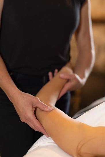 Manual lymphatic drainage hands-on treatment at NDI Aesthetics